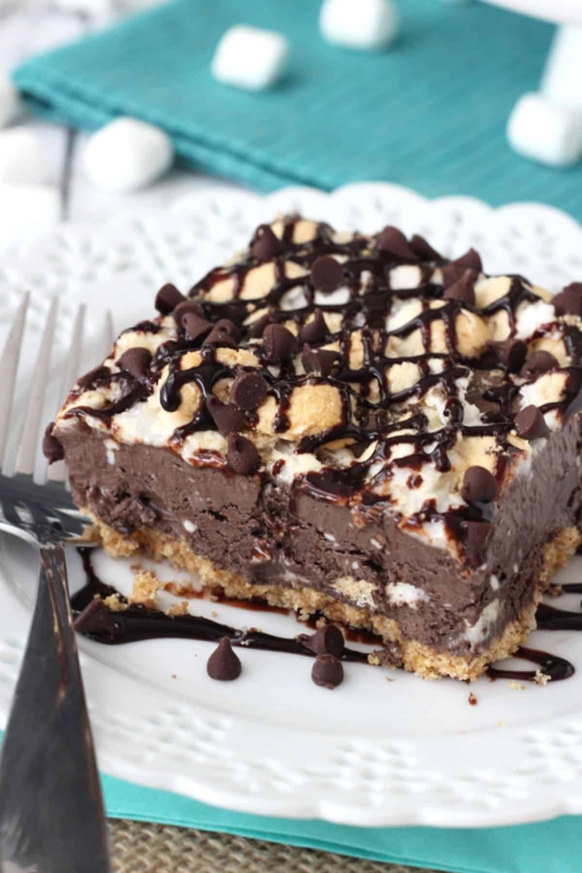 A slice of s'mores ice cream bars on a small white plate.