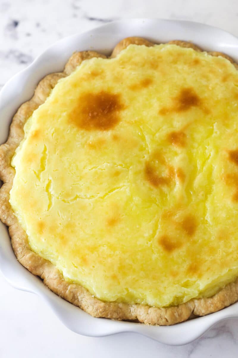 With a thick, creamy custard in a flaky, buttery pie crust, this coconut custard pie delivers just the right amount of coconut flavor. Overhead view of a coconut custard pie