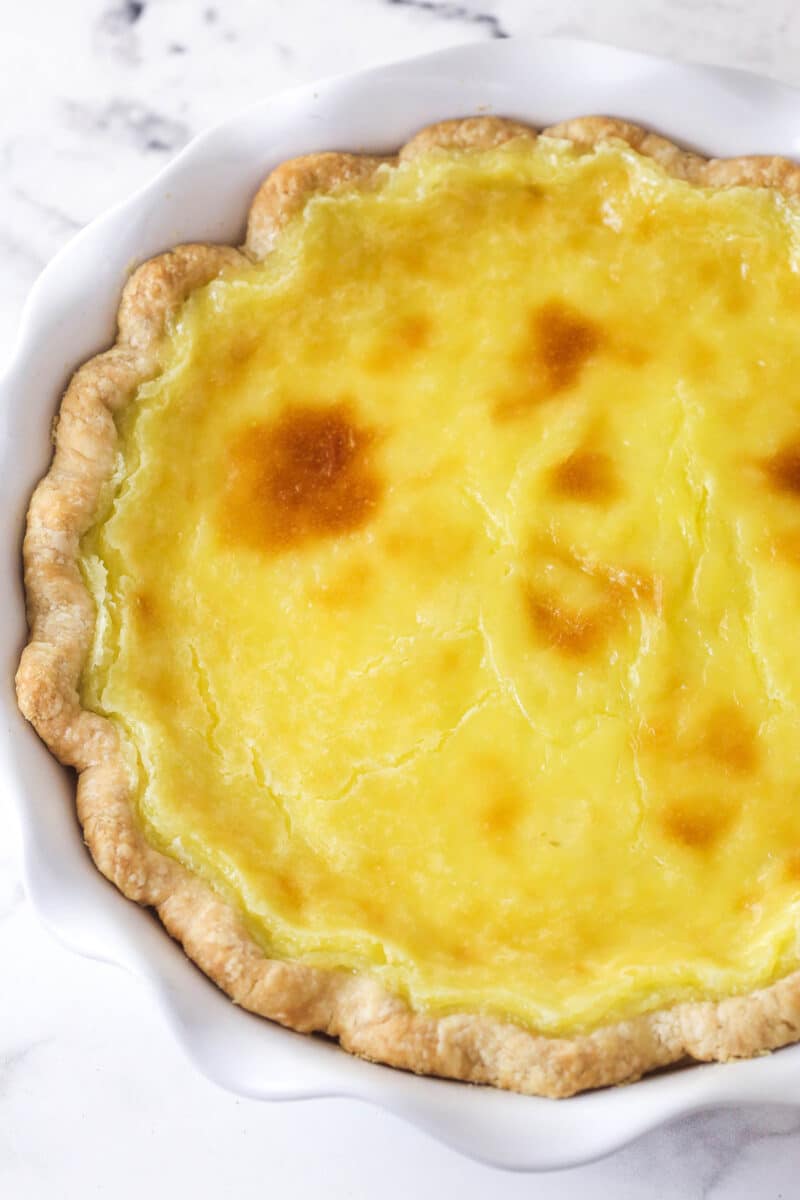 With a thick, creamy custard in a flaky, buttery pie crust, this coconut custard pie delivers just the right amount of coconut flavor. Overhead view of a coconut custard pie after its cooled