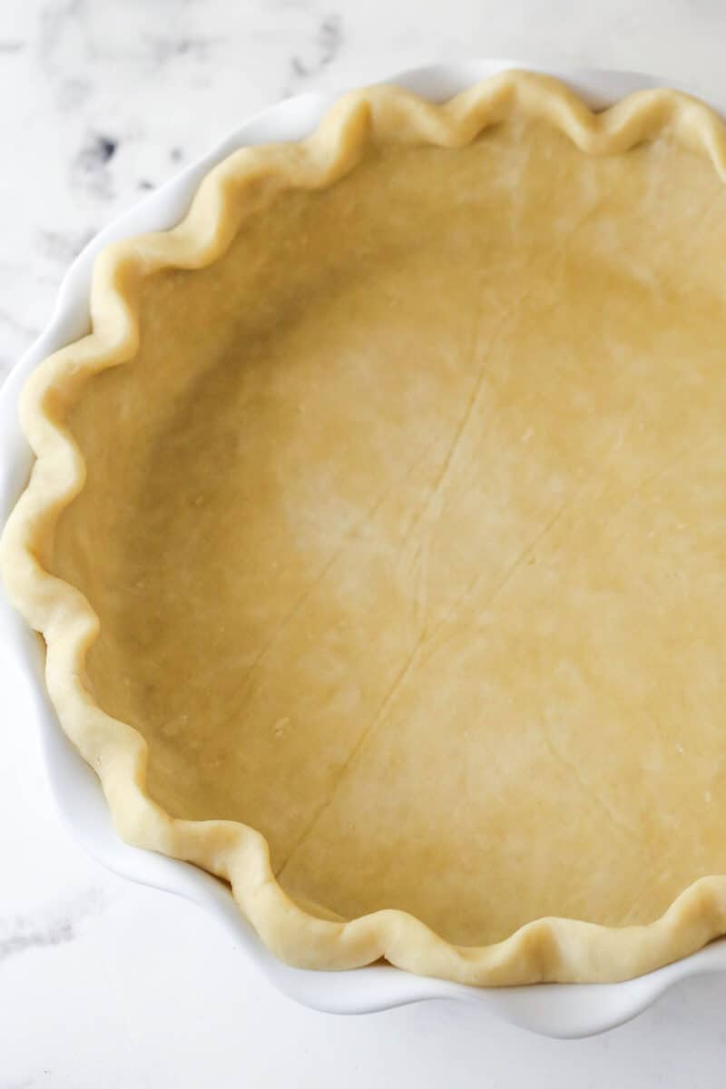 With a thick, creamy custard in a flaky, buttery pie crust, this coconut custard pie delivers just the right amount of coconut flavor. Unbaked pie crust in a pie plate