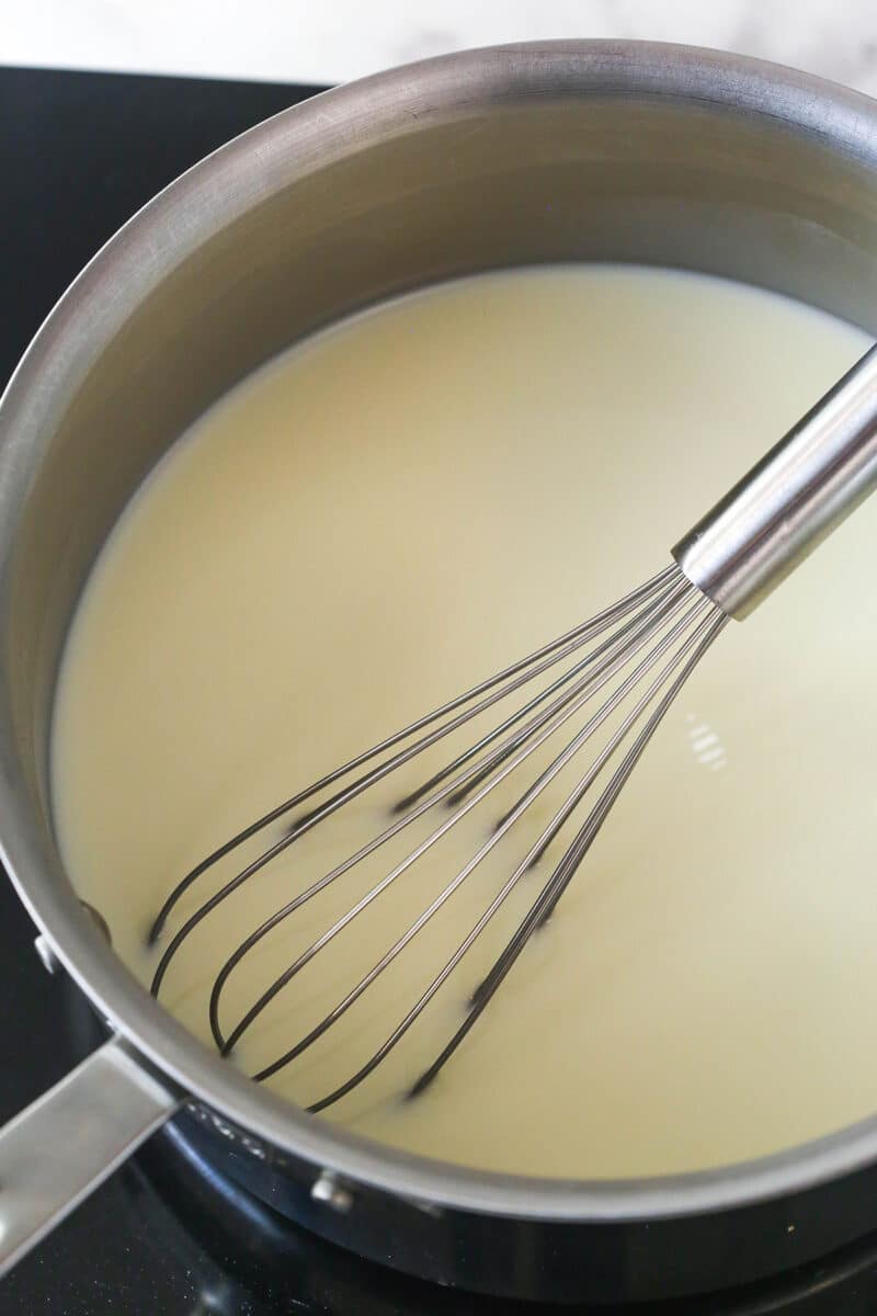 This copycat Magnolia Bakery Banana Pudding is made completely from scratch and mirrors the texture and flavors of the original. Whisking milk and sugar together