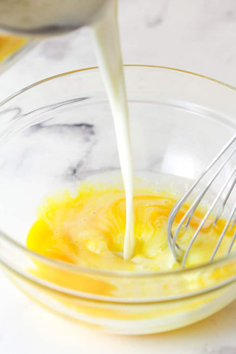 This copycat Magnolia Bakery Banana Pudding is made completely from scratch and mirrors the texture and flavors of the original. Whisking a small amount of hot milk into egg yolks