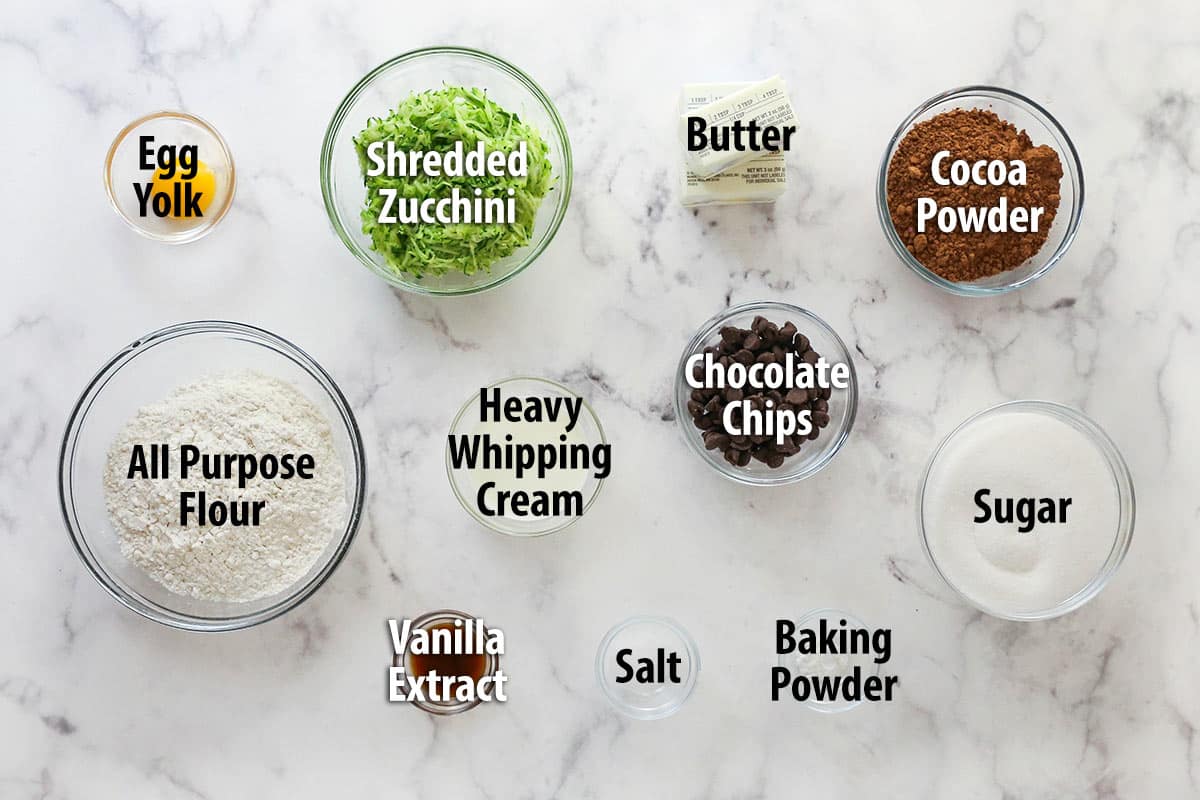 These zucchini brownies are not only quick and easy to make, they have the perfect super dense and fudgy texture. Overhead view of ingredients needed to make zucchini brownies