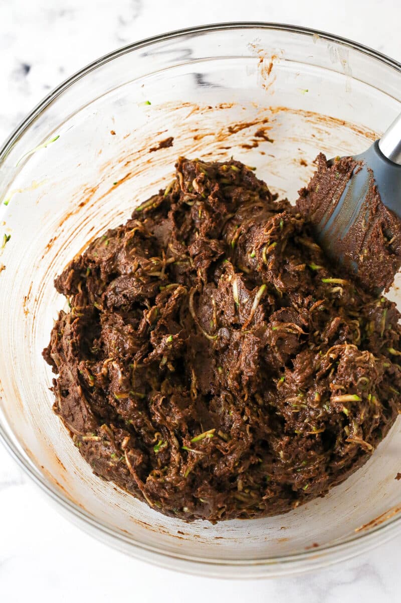 These zucchini brownies are not only quick and easy to make, they have the perfect super dense and fudgy texture. Folding shredded zucchini into brownie batter