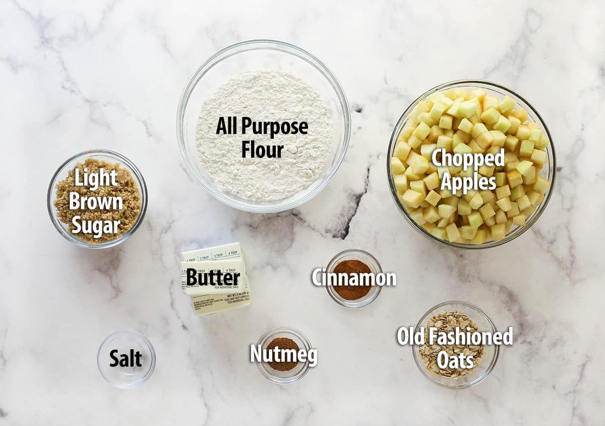 Apple pie bars offer all of the flavor of apple pie in a simple, easy-to-make bar, with shortbread crust, spiced apples, and crumble topping. Overhead view of apple pie bar ingredients