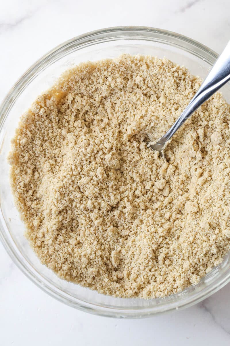 Apple pie bars offer all of the flavor of apple pie in a simple, easy-to-make bar, with shortbread crust, spiced apples, and crumble topping. Cutting butter into the flour and brown sugar mixture
