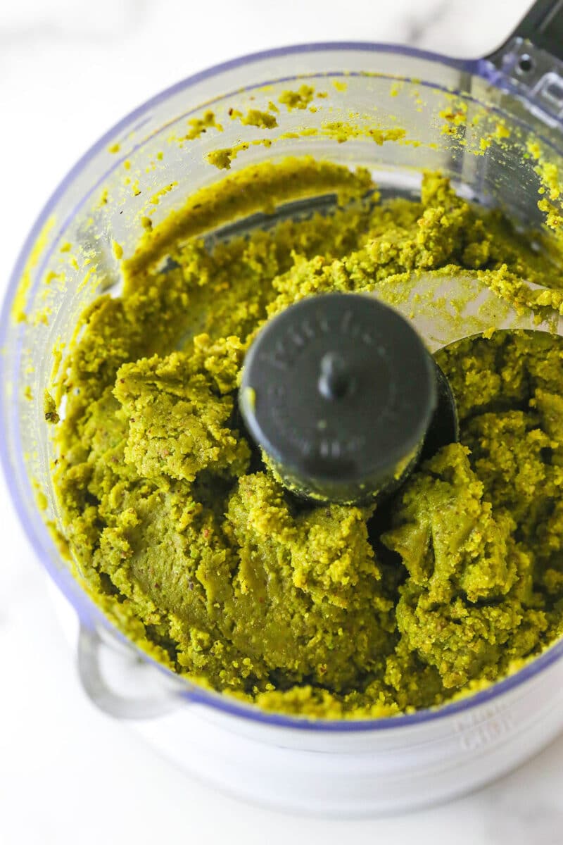 These pistachio cupcakes are full of real pistachios in the cupcakes and the buttercream, giving them their beautiful color and nutty flavor. Pistachio paste in a food processor
