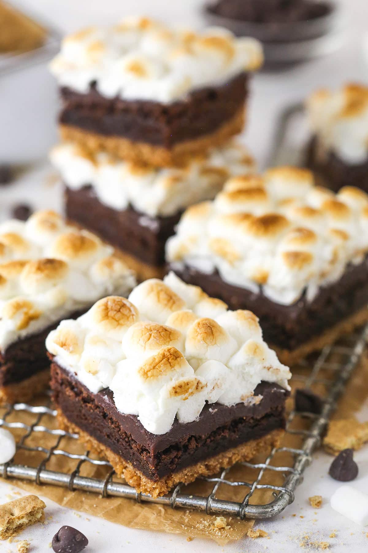 These s'mores brownies have all the classic flavors, with a graham cracker crust, fudgy brownies, ganache, and toasted marshmallows. S'mores brownies on a cooling rack