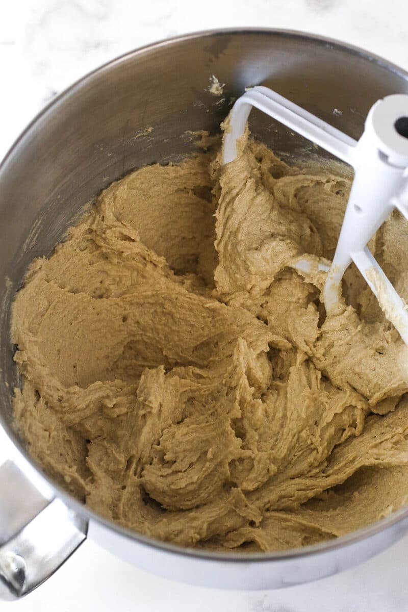 Brownie cookie dough ice cream sandwiches combine three favorites in one, with a few key ingredients to ensure they stay soft. Corn syrup mixed in.