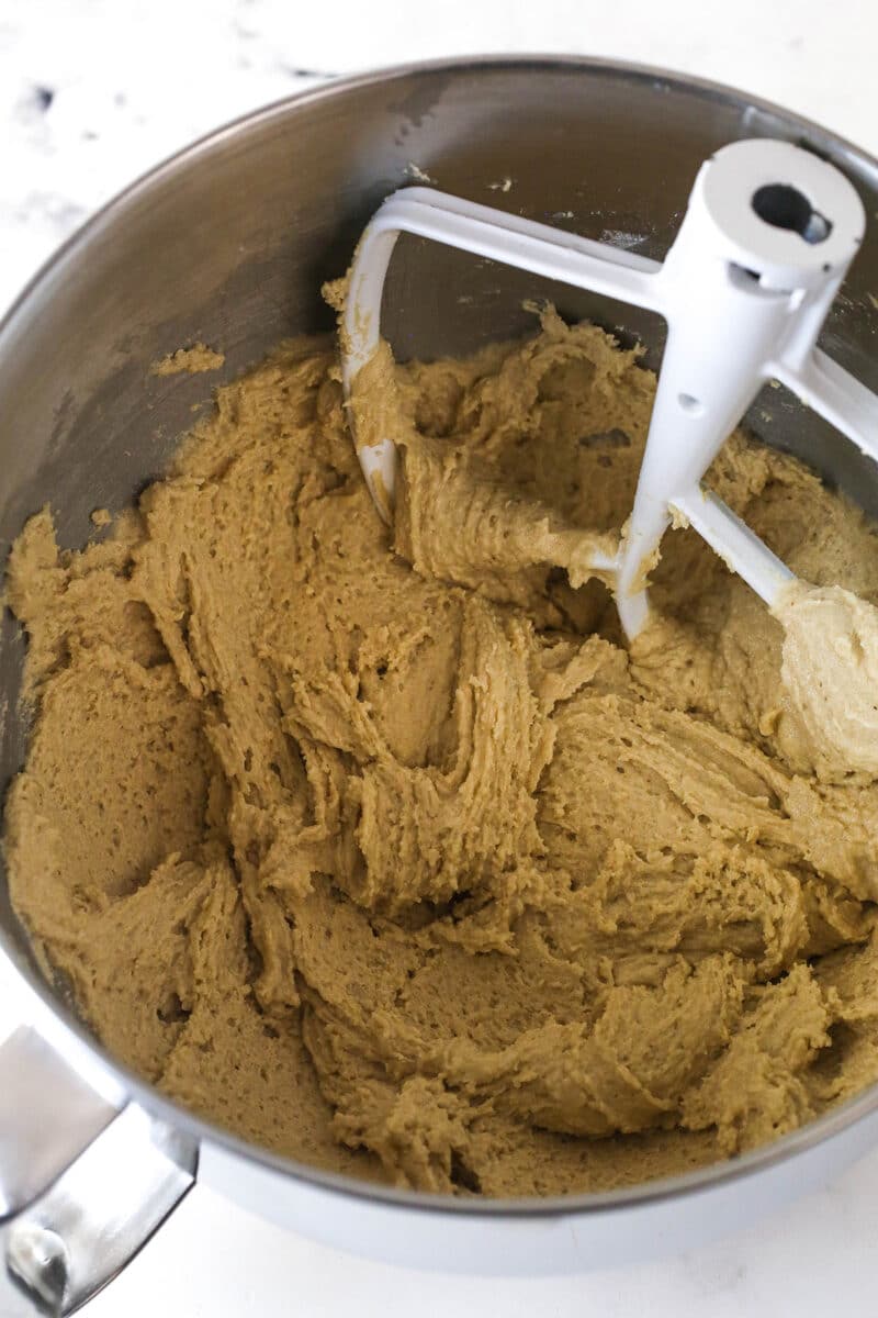 Brownie cookie dough ice cream sandwiches combine three favorites in one, with a few key ingredients to ensure they stay soft. Cookie dough batter in a mixing bowl