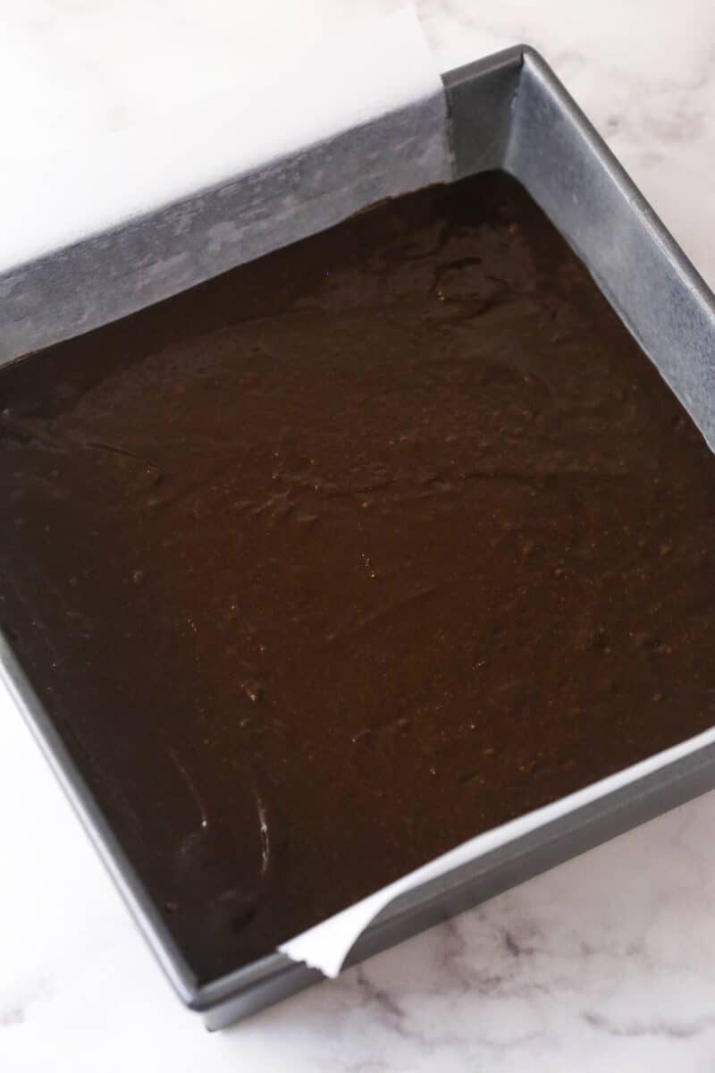 Creamy peanut butter is swirled into rich, chewy chocolate brownies in this easy Peanut Butter Brownies recipe. Brownie batter in a square pan