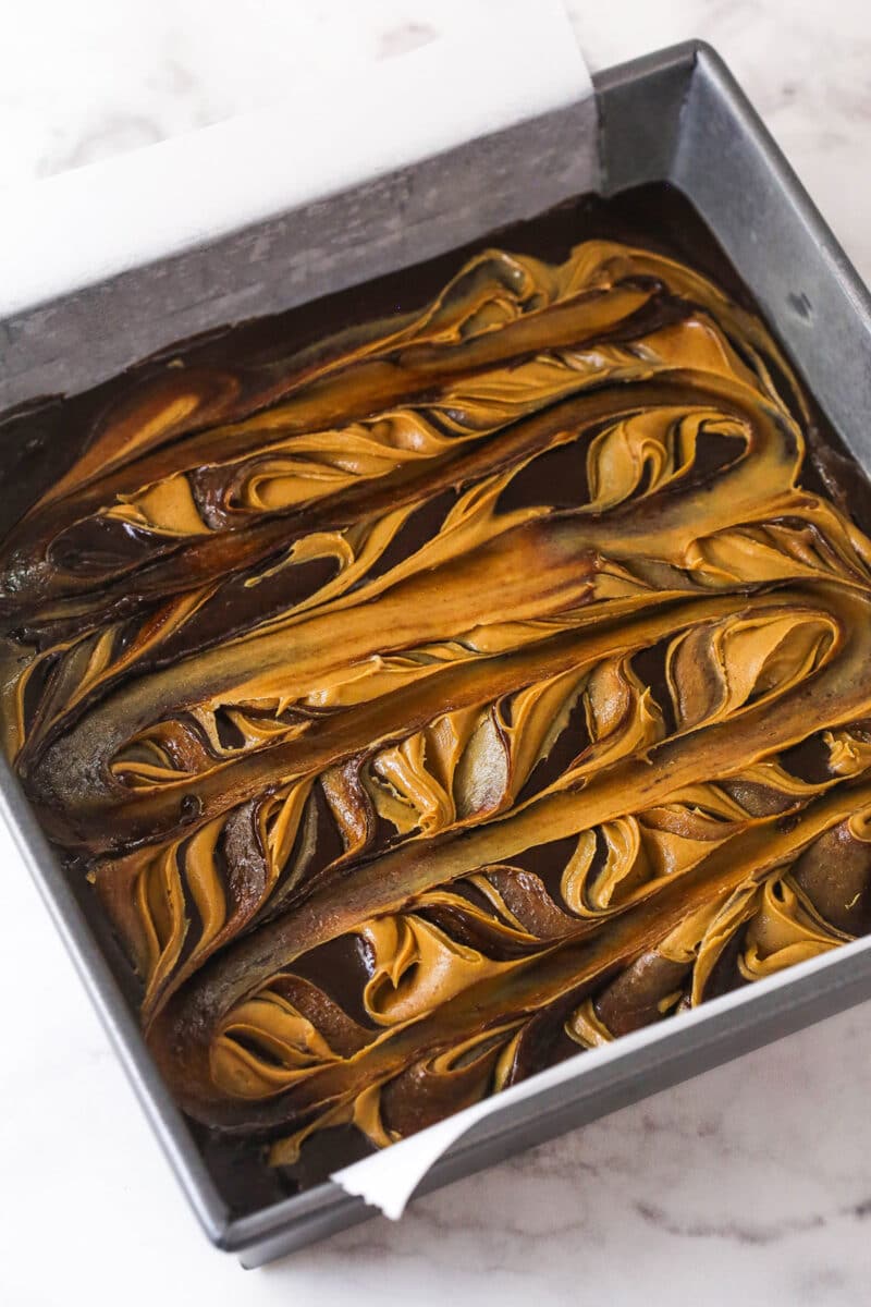 Creamy peanut butter is swirled into rich, chewy chocolate brownies in this easy Peanut Butter Brownies recipe. Peanut butter swirled into brownie batter