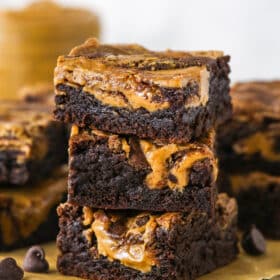 A stack of three brownie butter brownies showing the sides
