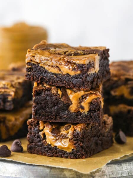 A stack of three brownie butter brownies showing the sides
