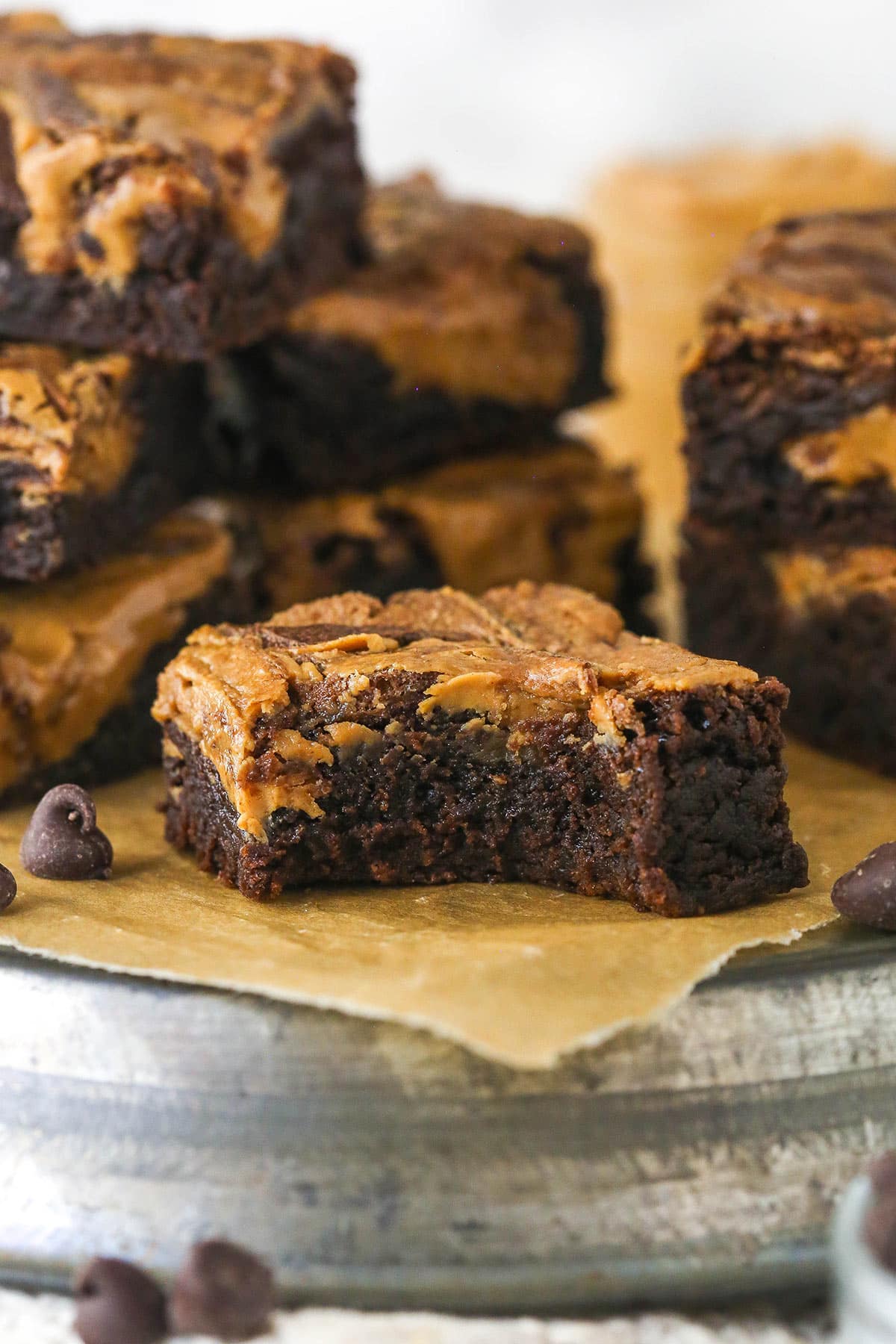 Creamy peanut butter is swirled into rich, chewy chocolate brownies in this easy Peanut Butter Brownies recipe. A peanut butter brownie with a bite missing