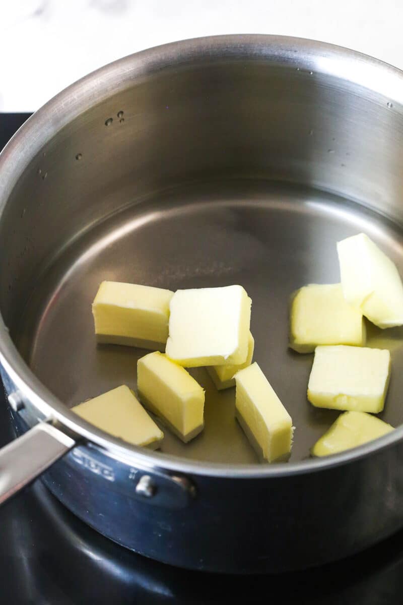 Turn 6 ingredients into the perfect choux pastry base for eclairs, cream puffs, and more with these expert tips. Cubes of butter in a pan