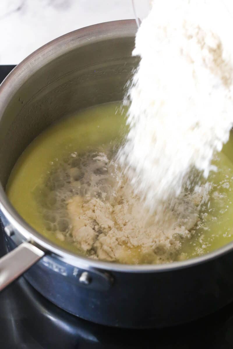 Turn 6 ingredients into the perfect choux pastry base for eclairs, cream puffs, and more with these expert tips. Adding flour to melted butter in a pan
