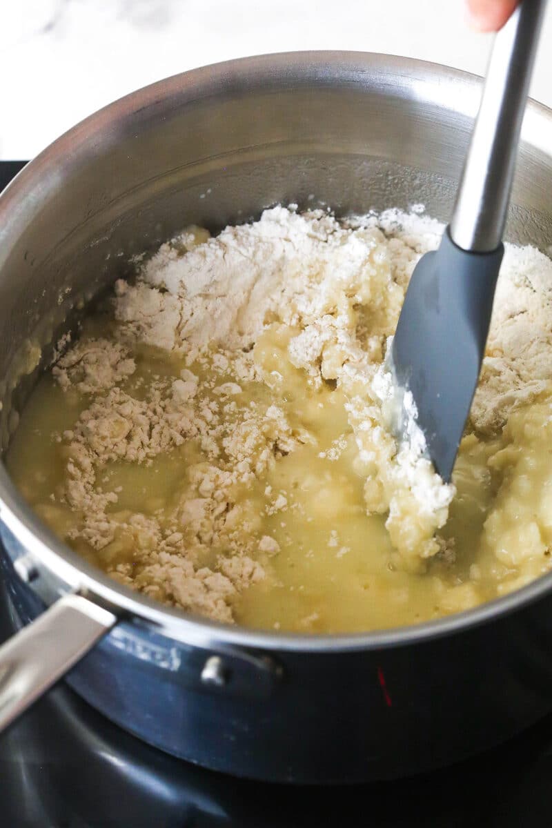 Turn 6 ingredients into the perfect choux pastry base for eclairs, cream puffs, and more with these expert tips. Stirring flour into melted butter in a pan