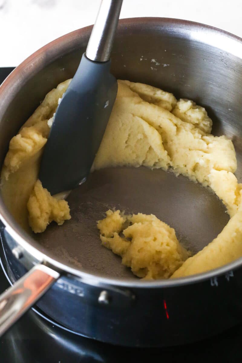 Turn 6 ingredients into the perfect choux pastry base for eclairs, cream puffs, and more with these expert tips. Pressing the cooked flour against the pan
