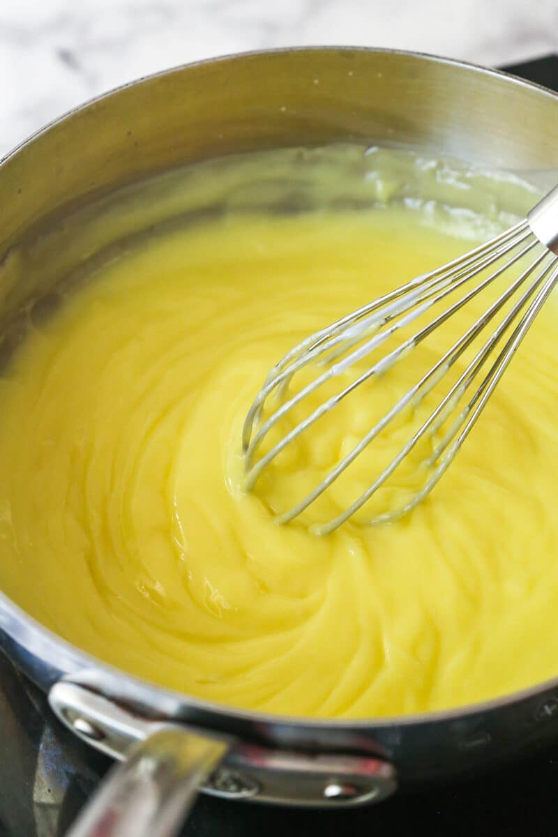 Thick, smooth, and creamy, this chocolate pastry cream (aka chocolate crème pâtissière) can be used in cakes, pastries, and other desserts. Whisking pastry cream in a pan