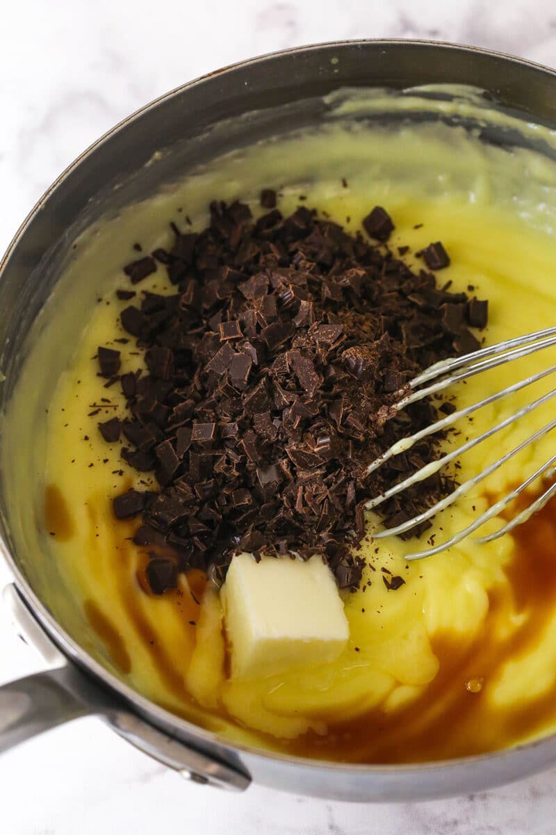 Thick, smooth, and creamy, this chocolate pastry cream (aka chocolate crème pâtissière) can be used in cakes, pastries, and other desserts. Stirring chopped chocolate, butter, and vanilla into a pan