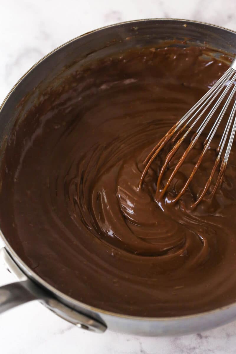Thick, smooth, and creamy, this chocolate pastry cream (aka chocolate crème pâtissière) can be used in cakes, pastries, and other desserts. Stirring chocolate pastry cream in a pan