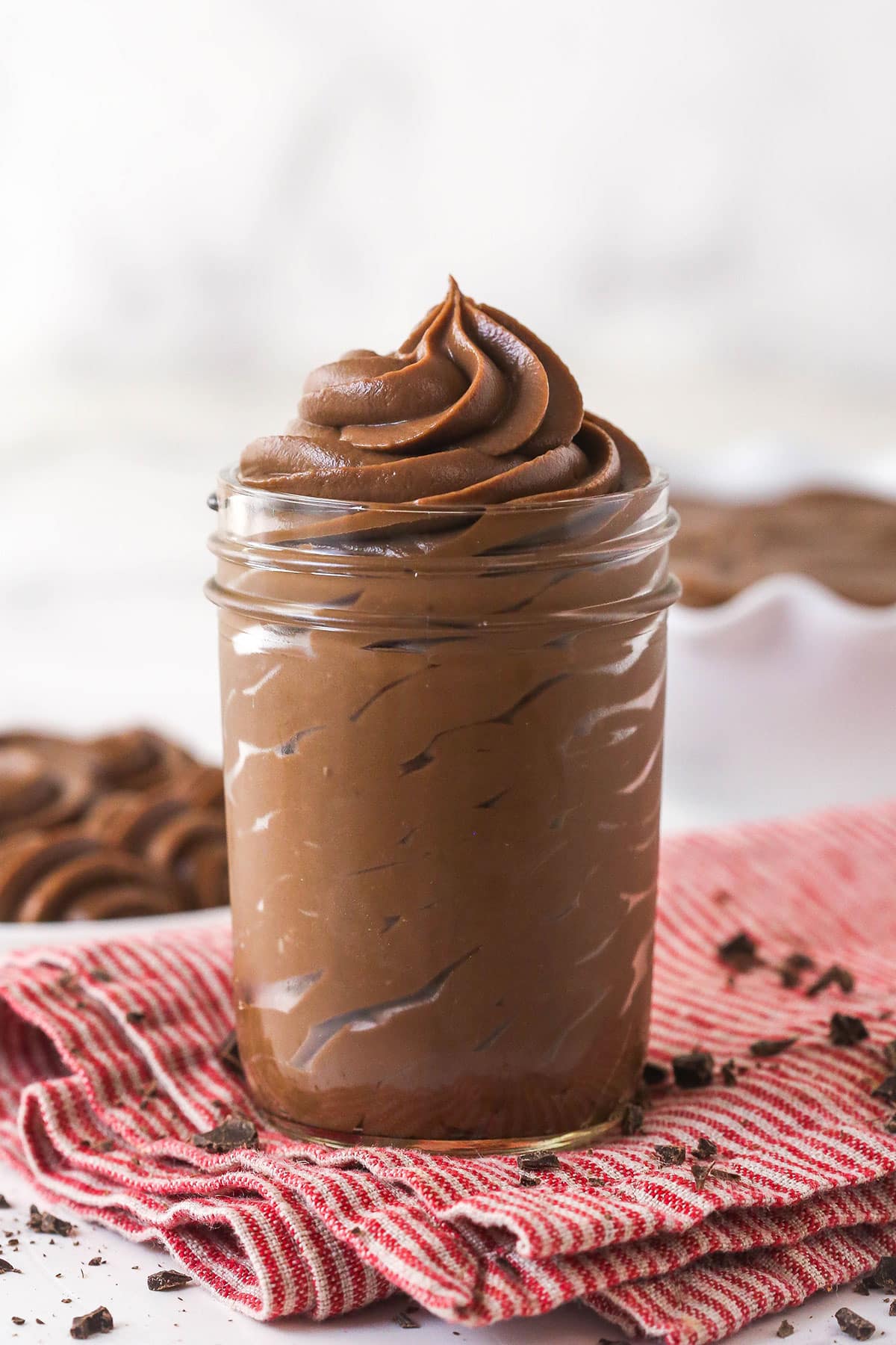 Thick, smooth, and creamy, this chocolate pastry cream (aka chocolate crème pâtissière) can be used in cakes, pastries, and other desserts. A glass jar of chocolate pastry cream