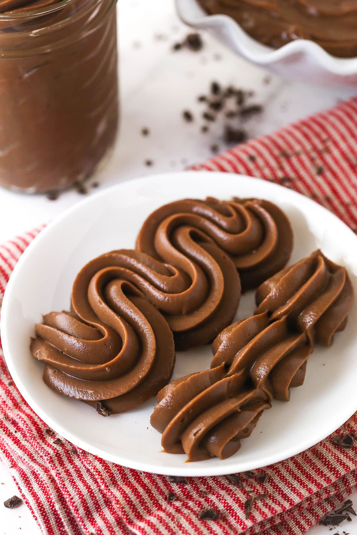 Thick, smooth, and creamy, this chocolate pastry cream (aka chocolate crème pâtissière) can be used in cakes, pastries, and other desserts. Chocolate pastry cream piped onto a white plate