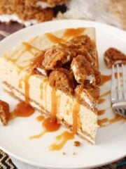 Top view of a slice of no bake oatmeal cream pie cheesecake on a white plate.