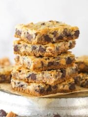 Side view of a stack of magic cookie bars.