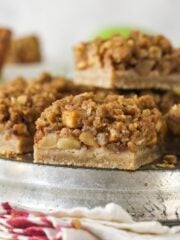 Side view of a plate of apple pie bars