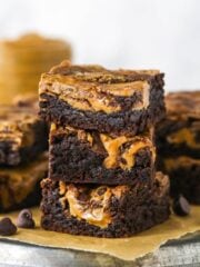 A stack of three brownie butter brownies showing the sides