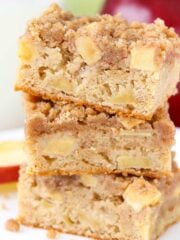 Close up of three apple streusel bars stacked one on top of the other.