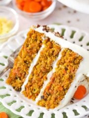 A slice of carrot cake on a plate.