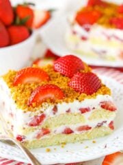 Slice of strawberry cake with berry cream filling.