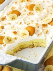 Banana pudding with a slice taken out of it.