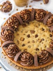 Reese's peanut butter cookie cake on a serving plate.