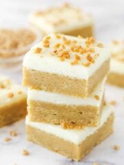A stack of frosted maple cookie bars.